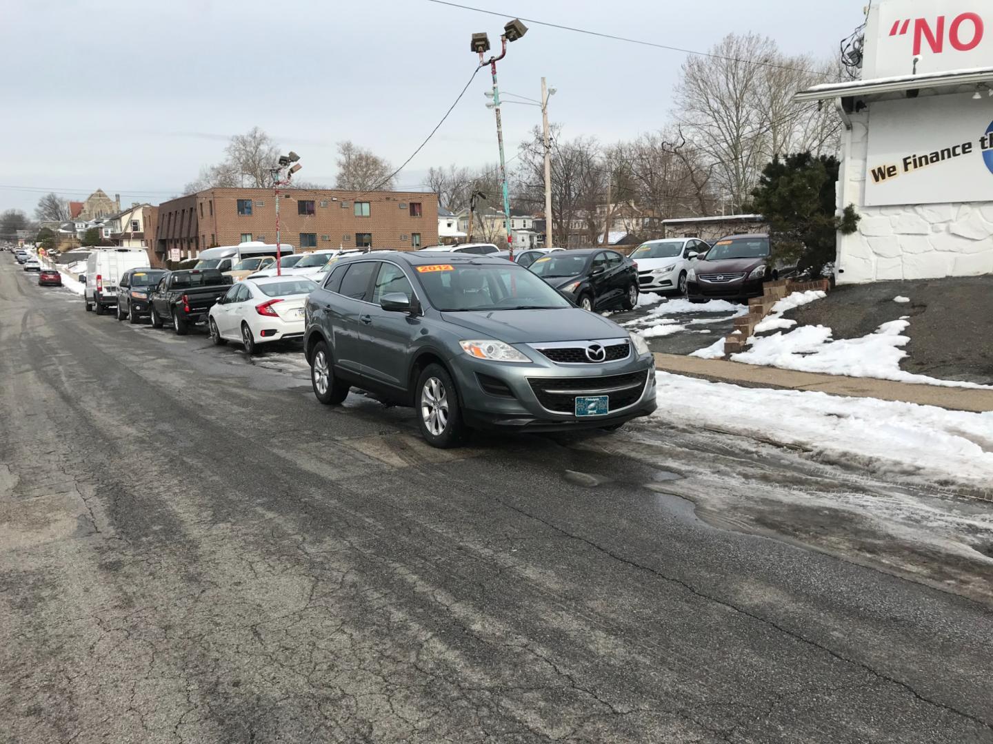 2012 Green /Tan Mazda CX-9 Sport (JM3TB3BV4C0) with an 3.7 V6 engine, Automatic transmission, located at 577 Chester Pike, Prospect Park, PA, 19076, (610) 237-1015, 39.886154, -75.302338 - Photo#1